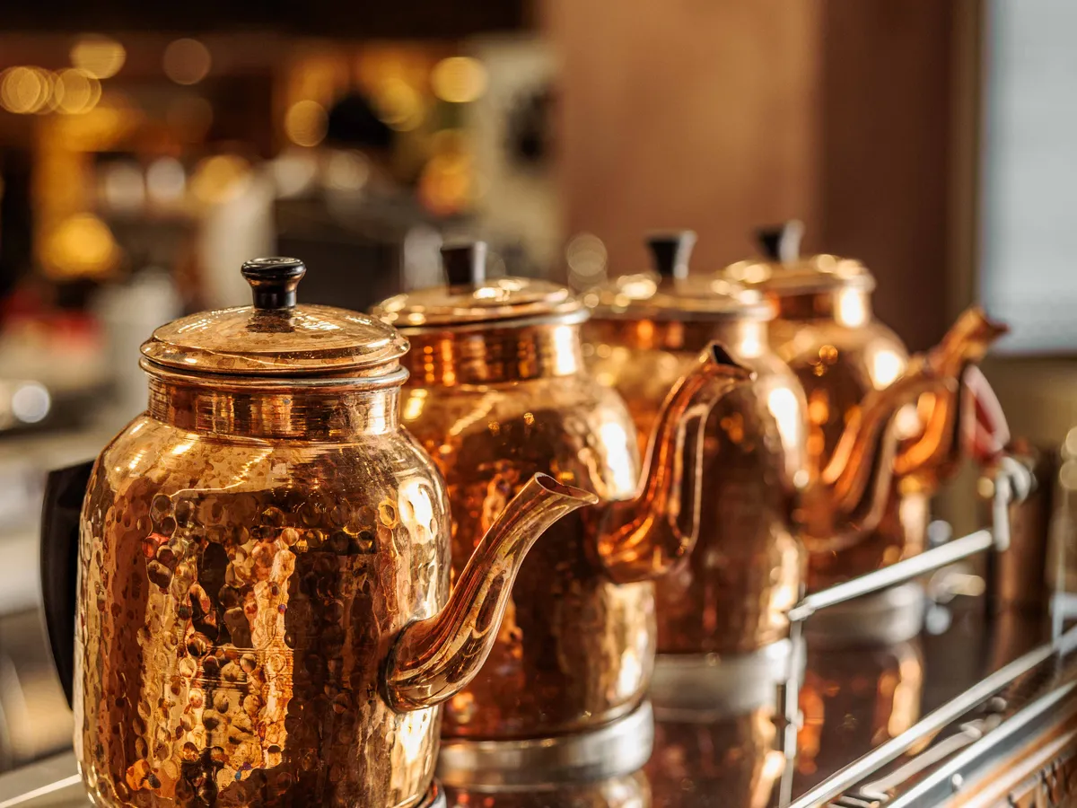Copper kettles on the counter at Ghancha Café